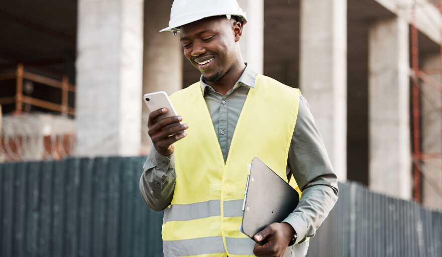 Professional man at construction site on phone