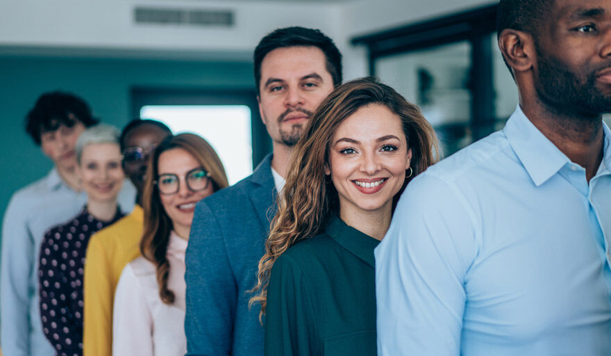 Line of professionals smiling